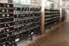 Sn�mek z lampovny jednoho ze z�vod� OKD. V pop�ed� stojan se z�chran��sk�mi p��stroji a d�le stojany se sv�tidly T 1002.09 a 16 623G.